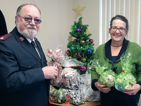 What started as a Mitten Tree at The Tillsonburg News more than 27 years ago evolved into The Tree of Warmth with community-donated mittens, gloves, scarves, toques, coats, toys (including and blankets coming from individuals and businesses. In 2016 Sharon Craig (right) made a presentation to Major Rick Shirran, Executive Director of Corps & Community Services in Tillsonburg. This year mittens, toques and scarves are being accepted at the Tillsonburg BIA office until Dec. 3. (Chris Abbott/File photo)