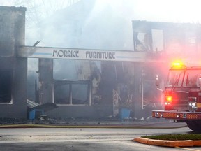 Tillsonburg Fire and Rescue Services arrived at Morrice Furniture Store, 97 Simcoe Street at 2:25 p.m. Wednesday afternoon to find heavy smoke coming from the building. Soon after it was fully engulfed and the local firefighters, assisted by units from South-West Oxford and Norfolk, worked to put it out and prevent it from spreading. Simcoe Street was closed for several hours. (Chris Abbott/Norfolk and Tillsonburg News)