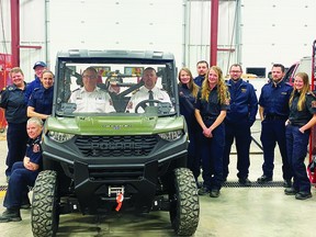 Members of the Champion Fire Department with the department's new vehicle, a 2021 Polaris Ranger.
