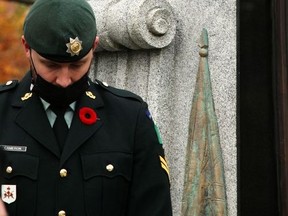 A sentry stands guard at one corner of the Wodostock cenotaph during Thursday's Remembrance Day ceremony.
BRUCE URQUHART/SENTINEL-REVIEW