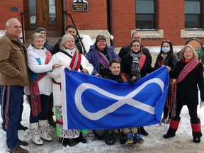 (From left) Joel Henley, Nina Henley, Karen Cederwall, Colette Surovy, Hayden Stenlund, Theresa Stenlund, Jodi Cooke, Sharon Smith during the Métis flag raising at Kenora city hall on Monday, Nov. 15.