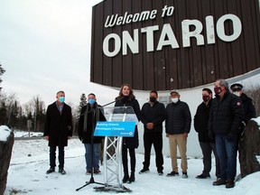 Ontario Minister of Transportation Caroline Mulroney speaks at an announcement as representatives from the federal government, Shoal Lake #39, City of Kenora and the Ontario Provincial Police look on at the Ontario/Manitoba border on Friday, Nov. 19.
