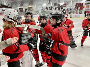Kenora Thistle Joshua Nowe holds the Challenge Cup as Carter Wilson, Kai Dingwall, Lucas Hill and Evan Minor look on following Kenora's 7-0 win over the KC Sabres from Thunder Bay at the Kenora Recreation Centre. The Thistles won their first Challenge Cup since 2006 over the weekend.