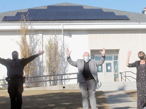 Millet's manager of Enforcement Services Mitch Newton, Mayor Doug Peel and CAO Lisa Schoening encourage residents to look up at the Civic Centre now that the new solar panels have been installed.