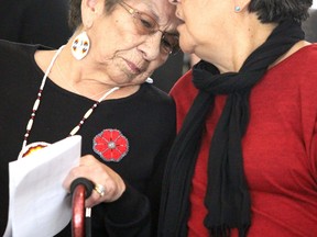 Shirley Roach is comforted by Barbara Nolan after speaking at ceremony marking signing of addendum to a covenant with Algoma University, Shingwauk Education Trust and Shingwauk Kinoomaage Gamig at Arthur A. Wishart Library at Algoma University in November 2018. BRIAN KELLY