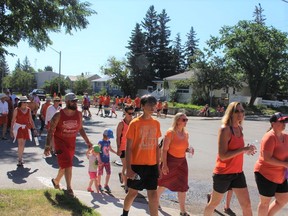 Dozens of residents participated in a Canada Day walk to honour residential school victims.