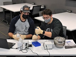 Bachelor of agriculture technology students, Colby Yaremie (left) and Matthew Pfeffer, prepare soil samples for analysis using the iMETOS MobiLab.