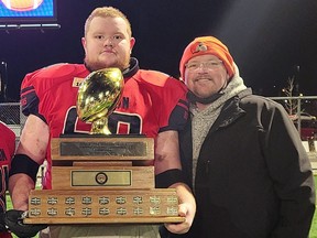 London Beefeaters all-star offensive lineman Brayden Bell of Sarnia, Ont., celebrates with his father, Jim, after winning the Ontario Football Conference championship in Windsor, Ont., on Saturday, Nov. 20, 2021. Contributed Photo