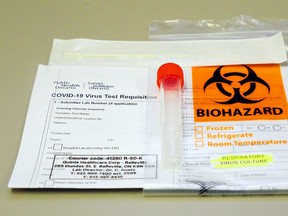 A COVID-19 testing kit rests on a countertop in the medical microbiology laboratory of Belleville General Hospital, which on Thursday had four patients with the virus. The area's acting medical officer recommends people reduce close contacts to curb the current rapid spread of the virus.