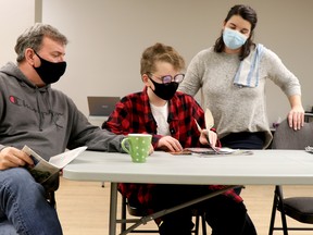 Tim Bass, Riley Korschin and Amanda Moss rehearse a scene from Algoma Repertory Theatre's production of A Christmas Story. BRIAN KELLY