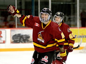 Timmins Rock forwards Riley Brousseau, foreground, and Christopher Engelbert celebrate the former’s second goal of the game and 11th of the season during the second period of Sunday afternoon’s NOJHL game at the McIntyre Arena. The Rock completed a stretch of three games in two-and-a-half days by defeating the Powassan Voodoos 7-2 and securing top spot in the NOJHL’s overall and East Division standings. THOMAS PERRY/THE DAILY PRESS
