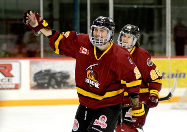 Timmins Rock forwards Riley Brousseau, foreground, and Christopher Engelbert celebrate the former’s second goal of the game and 11th of the season during the second period of Sunday afternoon’s NOJHL game at the McIntyre Arena. The Rock completed a stretch of three games in two-and-a-half days by defeating the Powassan Voodoos 7-2 and securing top spot in the NOJHL’s overall and East Division standings. THOMAS PERRY/THE DAILY PRESS