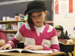 Grade 5 student Akane Scott wears a hat during reading time in her class to raise awareness about mental health. Kevin Hampson/Postmedia Network