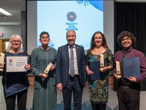 Mayor's Arts Awards winners Irene High (accepting the Limestone Arts Legacy Award for Wally High), Marney McDiarmid (Creator award), Rosemary Doyle (representing Creator award winner Theatre Kingston) and Ricky Brant (Creator award) flank Mayor Bryan Paterson at Monday night's ceremony at the Tett Centre. Photo courtesy of Chris Miner.

Caption: 2021 Mayor’s Arts Awards recipients and Mayor Bryan Paterson. From left to right: Irene High (Wally High, Limestone Arts Legacy Award), Marney McDiarmid (Creator Award), Mayor Paterson, Rosemary Doyle (Theatre Kingston, Creator Award), and Ricky Brant (Creator Award). Not included is Katherine Porter (Arts Champion Award).