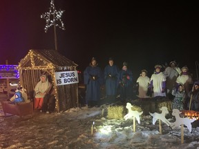 South Kinloss Presbyterian Church endured the chilly winds on Friday, November 26 to perform their live nativity scene. L-R: Liam Peel (in cradle), Aiden Peel, Ellen Peel, Mathias Peel (hidden). Back Row: Gerard Lang, Dale Gilchrist, Charlotte Moore, Sofia vanMeeteren, Olivia vanMeeteren, Marilynne Gilchrist, Ruby Andrew, Janet Dickie, Walter Dickie, Hannah Dickie.  Front Row: Zachary vanMeeteren, Caleb Dickie, Emma Dickie, Lori McKim-Lang. Hannah MacLeod/Lucknow Sentinel
