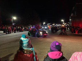 Thousands of children and adults lined Main Street in downtown Powassan Saturday night to enjoy the Smoke 'N' Spurs Parade of Lights.