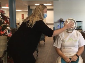 Cheryl COttrill, co-chair  of Huron SHores Hospice, takes a pie to the face on Facebook Live after reaching - and exceeding - their goal of $10,000 on Giving Tuesday (Dec 1). Hannah MacLeod/Kincardine News