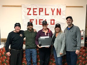 Can/Am Cowboys were champions of the 4th Grey Cup Warm-Up Open Mixed Bonspiel at the Tillsonburg Curling Club on Nov. 27. The Zeplyn Enterprises Inc. Trophy, presented by sponsor Sid Abrams (left) went to Jonathan Peter, Kathryn Peter, Catherine Fox and Jeff Fox. (Submitted)