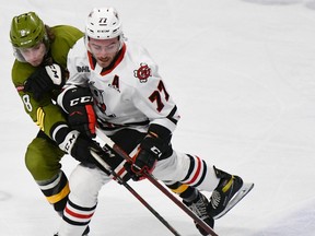 Avery Winslow of the North Bay Battalion and Dakota Betts of the Niagara IceDogs vie for the puck in their Ontario Hockey League game last Saturday night at the Meridian Centre. Each of the defencemen scored in the Troops' 5-1 win.
Sean Ryan Photo