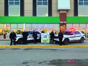 Last year's image of members of the Beaumont RCMP at the Sobeys to collect donations for their Stuff a Cruiser event. Image provided by Cheri-Lee Smith.