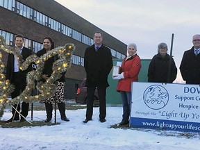 Members of Spruce Grove council, including mayor Jeff Acker, centre, joined the LIght Up Your Life Society for the lighting of the Dove of Hope in Spruce Grove last week.