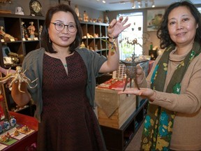 Friends and business partners Koi Thompson (left) and Maggie Liu have opened a new Stratford shop, Dancing Waters Boutique, on York Street. Similar to its predecessor, Symphony in Brass, the shop specializes in traditional Asian art, brassware, gift items, home decor and exotic jewelry. Chris MontaniniStratford Beacon HeraldPostmedia News