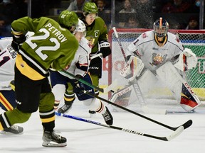 Matvey Petrov of the North Bay Battalion scores his first goal of the game against Barrie Colts goaltender Mack Guzda in Ontario Hockey League action Saturday night at the Sadlon Arena. Liam Arnsby provides traffic in front, while the Colts' Evan Vierling and Beau Akey play defence.
Sean Ryan Photo