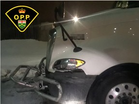 A commercial vehicle that struck a guardrail and fled the scene was later found by police at a truck stop, showing front-end damage.
