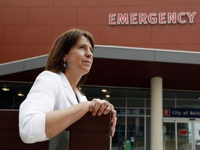 Quinte Health Care president and CEO Stacey Daub sits outside the emergency department of Belleville General Hospital. Local hospitals do not have the capacity for major surges in patients, she said.