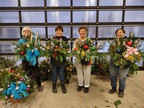 Bows and Boughs committee members (left) Joan McLaughlin, Dianne Simpson, Rose-Marie Meyer and Gail Van der Hoek pose with examples of the 28 planters assembled for sale to Ripley & District Horticultural Society members, friends and family.