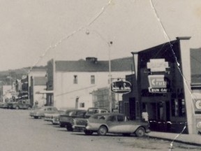 •	1983.1325.010 – Sun Café, owned and operated by Jack and Frank Lock, on east side of south end of Peace River’s busy Main Street, circa 1958. Photograph was on a post card.