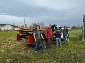 Noah McArthur, John Harper, Pat Van Den Hogan, David Grant and John Warrick stop for a photo while putting the Bruce Botanical Food Gardens new shed together. SUBMITTED