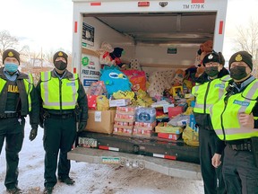 Butler GM sponsored the rental of a cube van to transport toys and food from the various Stuff a Cruiser locations in the Pembroke and Petawawa area. In the photo from left, Auxiliary Const. Todd Peters, Acting Auxiliary Sgt. Chris Graham, Auxiliary Const. Nathan Blanche, and Acting Auxiliary Staff Sgt. Antaire Lubitz.