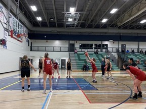 The St. Peter the Apostle Spartans seniors girls basketball team was defeated 63–45 by the Parkland Immanuel Penguins on Monday, Dec. 13, during their first regular season game. Photo by Balia Liboy.