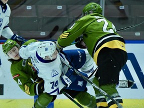 Dalyn Wakely and Ty Nelson of the visiting North Bay Battalion sandwich the Mississauga Steelheads' Zander Vecchia in their Ontario Hockey League game Friday night. It was the Troops' last before the holiday break, as a Saturday night date with the Niagara IceDogs was postponed.
Sean Ryan Photo