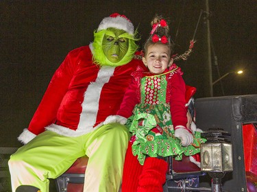 Parade co-chair Matt Suckel dressed as The Grinch, along with his five-year-old daughter Mila as Cindy Lou Who to lead the first annual Santa Claus parade in Waterford, Ontario on Saturday December 18, 2021, organized by the Waterford Lions Club. Brian Thompson/Brantford Expositor/Postmedia Network