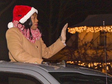 Haldimand-Norfolk MP Leslyn Lewis waves to people lining St. James St. S. in Waterford, Ontario on Saturday December 18, 2021 during the town's first annual Santa Claus parade. Brian Thompson/Brantford Expositor/Postmedia Network