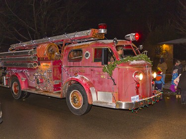 A retired fire truck from the former Simcoe Fire Department was adorned with Christmas lights and decorations as one of the entries in the first annual Waterford Santa Claus parade on Saturday December 18, 2021 in Waterford, Ontario. Brian Thompson/Brantford Expositor/Postmedia Network