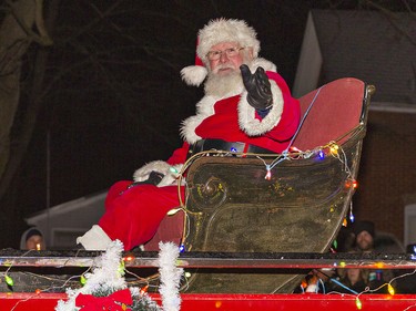 Santa waves to families who lined St. James St. S. in Waterford, Ontario on Saturday December 18, 2021 for the town's first-ever Santa Claus Parade, organized by the Waterford Lions Club. Brian Thompson/Brantford Expositor/Postmedia Network
