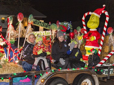 People on the Tri-County Mechanical float wave to those watching the first-ever Santa Claus parade on Saturday December 18, 2021 in Waterford, Ontario. Brian Thompson/Brantford Expositor/Postmedia Network