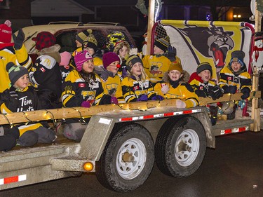 Waterford Wildcats players from the Waterford Minor Hockey Association smile as they sing along the SAnta Claus parade route on Saturday December 18, 2021. Brian Thompson/Brantford Expositor/Postmedia Network