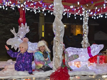 Youngsters riding on the Tim Horton's float seem to be enjoying themselves during the first-ever Santa Claus parade in the town of Waterford, Ontario on Saturday December 18, 2021. Brian Thompson/Brantford Expositor/Postmedia Network