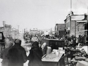 80.1131.006 – The Record-Gazette reported in its Feb. 5, 1932, edition the Main Street fire, which began in the Boyd Theatre and spread to several businesses on the west side. It necessitated the quick removal of as much furniture and stock as possible from the affected buildings. Curious onlookers and volunteers watch as flames devour the theatre. Kaufman Block No. 2; Trainor’s Hardware; T.R. Wilson’s Clothing Store; Sue Gee Sun Café ; Wong Lee Laundry; E.E. Orr Jewellery; and Simoneau’s Tinshop.