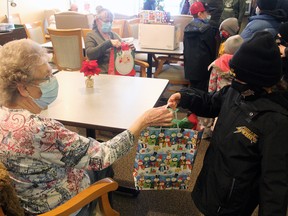 Millet Minor Hockey Association players stopped by John A. Smith Manor in Millet Saturday to deliver gifts and cheer to the residents.
Christina Max