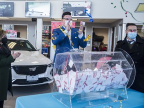 Cole Allinger, General Manager for Peter Smith Chev Cadillac, holds the winning Car4Cancer ticket as he is joined alongside Vicki Smith, former Owner of the dealership and Steve Cook, Executive Director for the Belleville General Hospital Foundation. Larry Shannon of Belleville was the lucky winner of a brand new Cadillac CT4 Sport