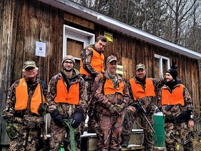 The author and his deer hunting gang pose for a group photo after a long day in the mountains.