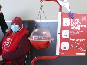 Maj. Sean Furey and Lorrie Scott at Metro Churchill Plaza in Sault Ste. Marie, Ont., on Wednesday, Dec. 22, 2021. (BRIAN KELLY/THE SAULT STAR/POSTMEDIA NETWORK)