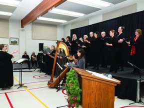 Laura Talbert is shown leading the Songbirds in carol at the Christmas Concert at the 50+ Seniors Club on Dec. 17. (Ealanta Photography)