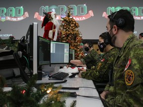 Cpl. William Jodoin and Aviator Julie Vallee keep an eye on their monitors at 22 Wing/CFB North Bay. They are members of Wolverine Flight, 21 Aerospace Control and Warning Squadron, on duty Christmas Eve.
PJ Wilson/The Nugget