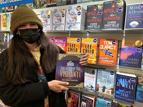 Carter VanEvery of Six Nations took advantage of the bargains on offer Boxing Day to expand his knowledge of the Marvel Universe. Behind VanEvery are some of the best-selling titles of the holiday season on display at the Coles outlet in Brantford. – Monte Sonnenberg